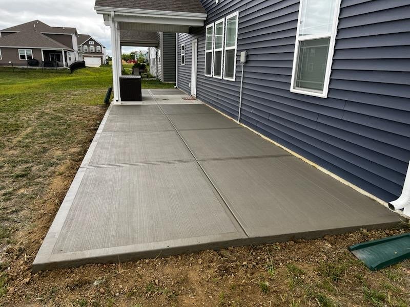 Concrete patio with a smooth picture-frame border