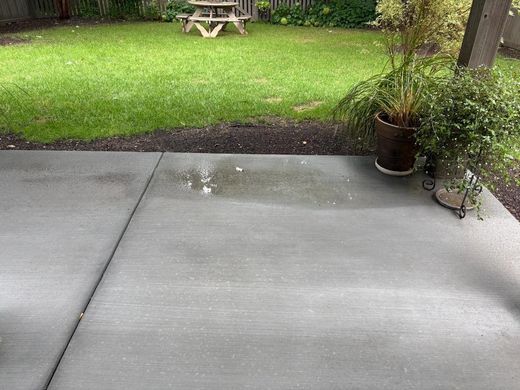New concrete patio replacing an old backyard patio