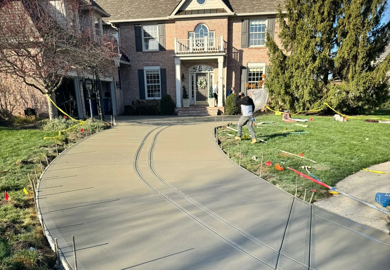Broom finished concrete driveway replacement in Indianapolis Indiana with tooled control joints