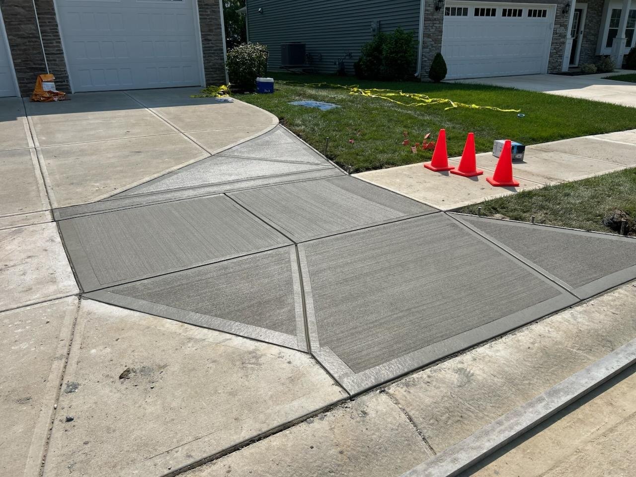 Concrete driveway extension adding side parking space at a home in Fishers Indiana