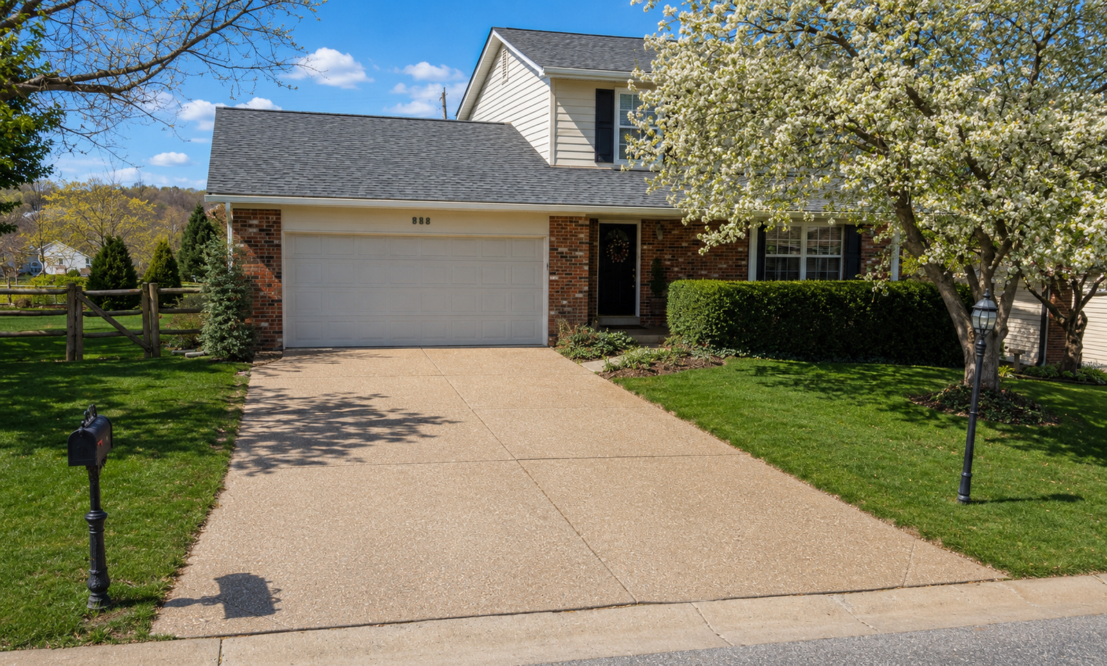 Exposed aggregate concrete driveway finish with decorative stone texture