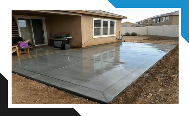 Gray residential concrete patio after a sealing application