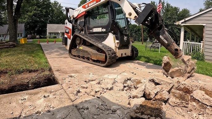Old driveway removal and excavation before concrete replacement in Indianapolis