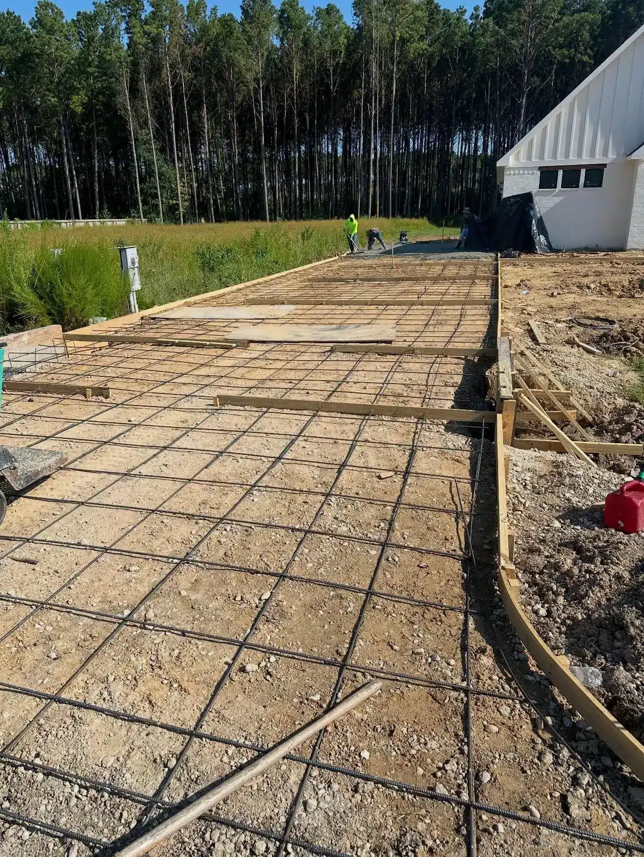 Concrete driveway forms and reinforcement set before pour in Indianapolis